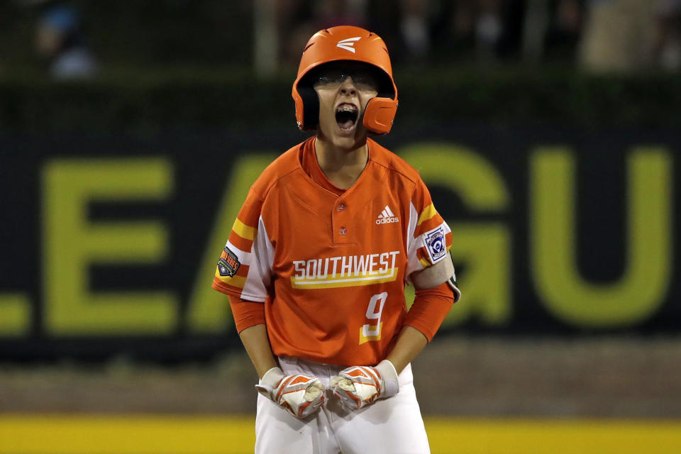 FILE - River Ridge, Louisiana's Conner Perrot celebrates as he stands on second base after driving in two runs with a double off Coon Rapids, Minnesota's Carson Trim in the fourth inning of an elimination baseball game at the Little League World Series tournament in South Williamsport, Pa., in this Monday, Aug. 19, 2019, file photo. The Little League World Series is planning to return in 2021 after last year's edition was canceled due to the COVID-19. (AP Photo/Gene J. Puskar, File)