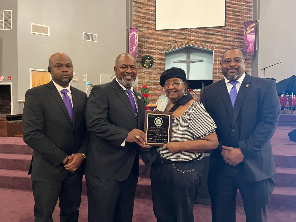 Last year's recipient of the "Outstanding Citizen of the Year," award Mary Ann Nichols Smith alongside standing beside Jonathan Strong, Maury Williams and Andre Corbett who are members of the Epsilon Upsilon Alumnus chapter of Omega Psi Phi Fraternity, Inc. Smith won the award for her activism and humanitarian efforts throughout Gaston County.