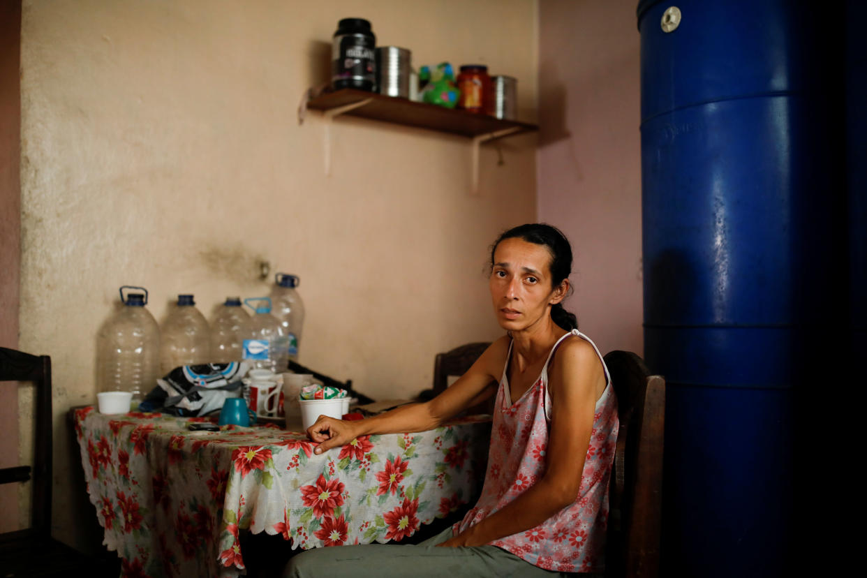 Yaneidi Guzman, 38, poses for a picture at her home in Caracas, Venezuela, Feb. 17, 2019. (Photo: Carlos Garcia Rawlins/Reuters)