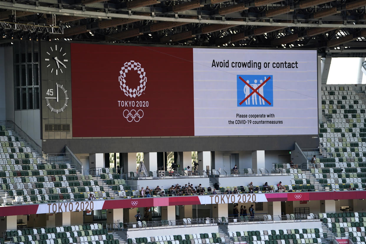 Covid-19 related warnings on the big screen ahead of the opening ceremony of the Tokyo 2020 Olympic Games at the Olympic Stadium in Japan. Picture date: Friday July 23, 2021. (Photo by Mike Egerton/PA Images via Getty Images)