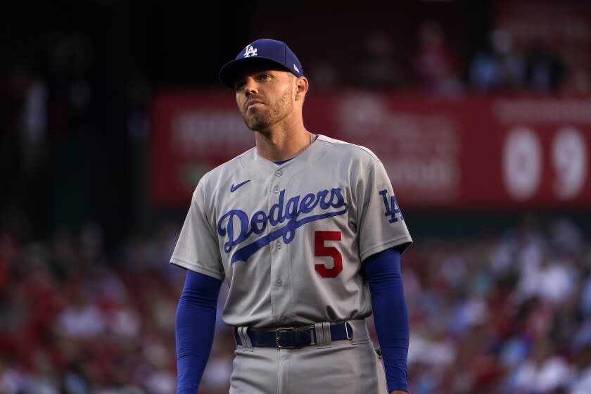 Los Angeles Dodgers first baseman Freddie Freeman looks into the crowd between pitches during the first inning of a baseball game against the St. Louis Cardinals Wednesday, July 13, 2022, in St. Louis. (AP Photo/Jeff Roberson)