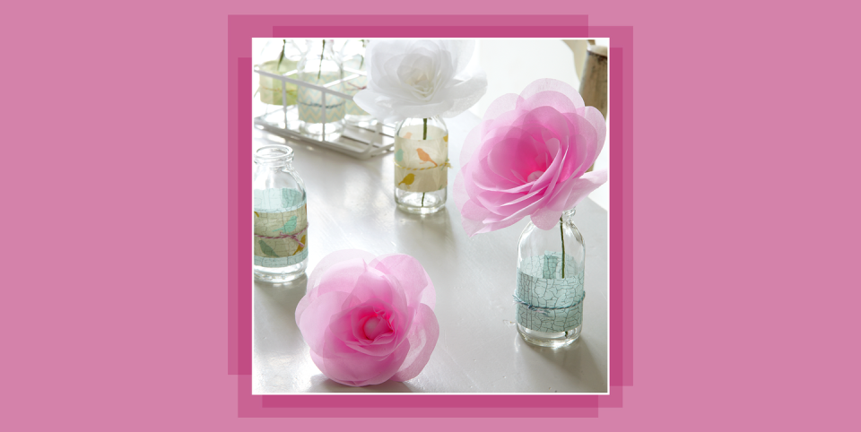 pink paper roses in glass vases