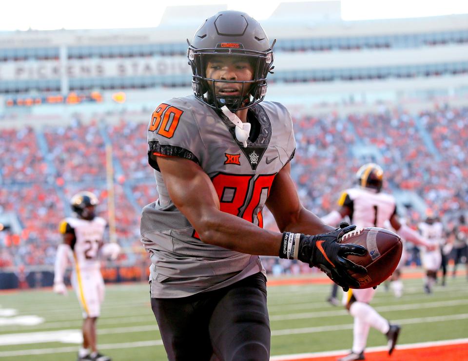 Sep 17, 2022; Stillwater, Oklahoma, USA; Oklahoma State's Brennan Presley (80) scores a touchdown in the second quarter during a college football game between the Oklahoma State University Cowboys (OSU) and the University of Arkansas at Pine Bluff Golden Lions at Boone Pickens Stadium.