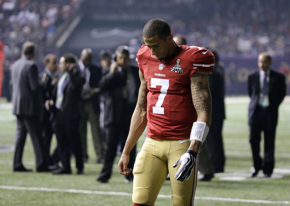 San Francisco 49ers quarterback Colin Kaepernick (7) walks on the sidelines during a Superdome power outage in the second half of the NFL Super Bowl XLVII football game between the 49ers and the Baltimore Ravens Sunday, Feb. 3, 2013, in New Orleans. (AP Photo/Matt Slocum)