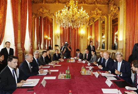 U.S. Secretary of State John Kerry (R) and British Foreign Secretary William Hague (2nd R) sit opposite French Foreign Minister Laurent Fabius (2nd L) at the P3 Foreign Ministers Meeting to discuss Syria, at the Quai d'Orsay in Paris September 16, 2013. REUTERS/Larry Downing