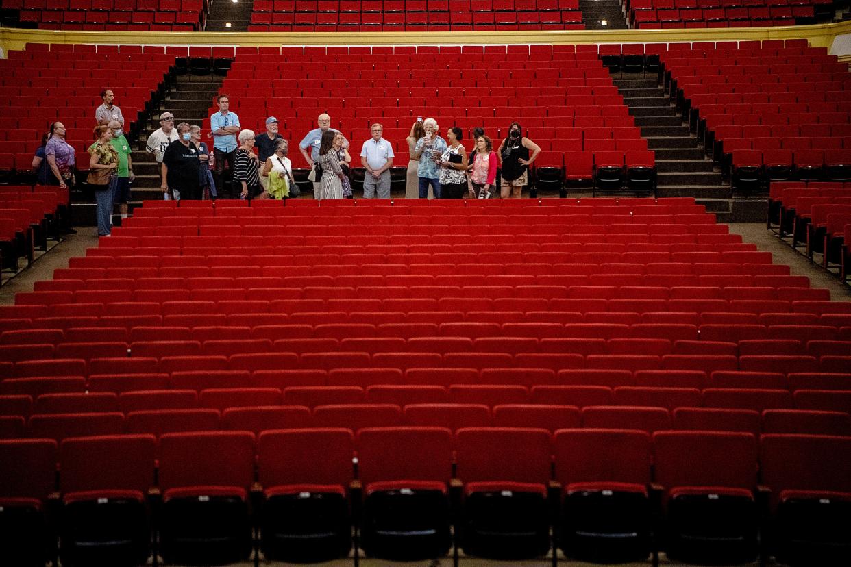 A group tours the Thomas Wolfe Auditorium August 21, 2023.