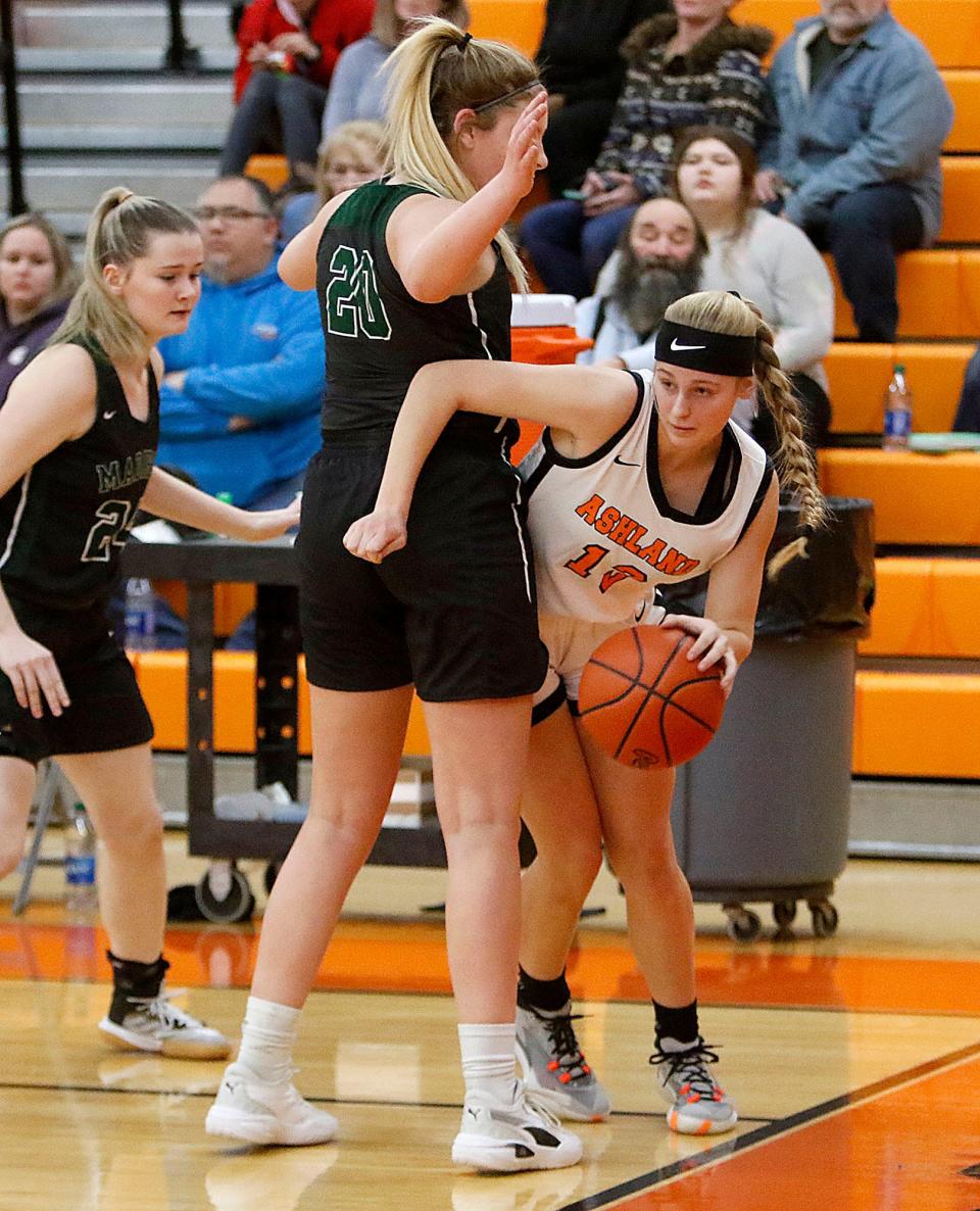 Ashland High School's Makaree Chapman (13) tries to dribble around Madison High School's Chloe Ebeling (20) on the baseline during high school girls basketball action Thursday, Jan. 20, 2022. TOM E. PUSKAR/TIMES-GAZETTE.COM