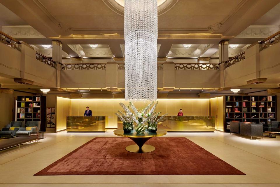 The lobby of the Hotel Cafe Royal in London, featuring a large chandelier