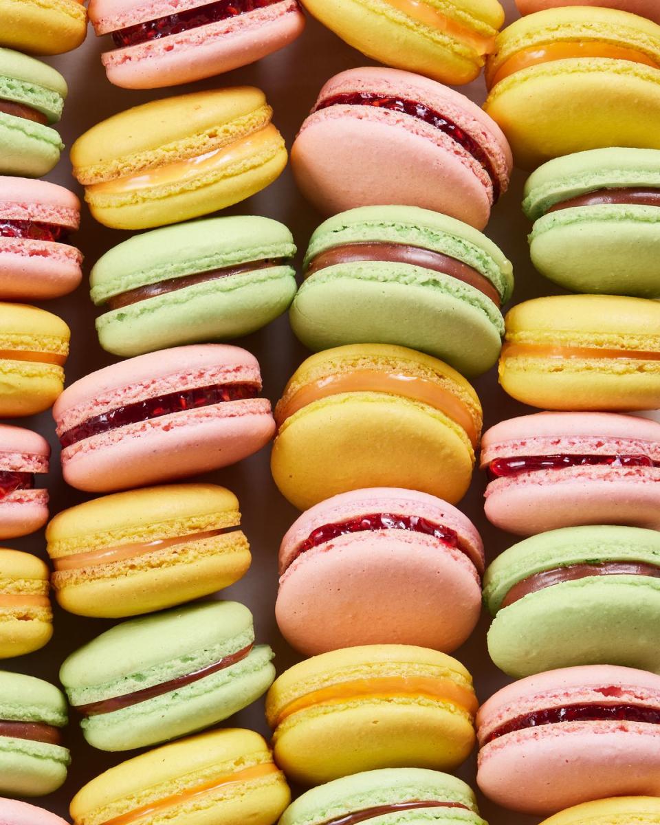 pink, yellow, and green macarons lined up together