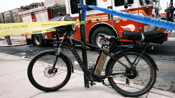 PHOTO: FILE - An electric bike with a battery sits parked outside of a Bronx supermarket the day after a 5-alarm fire tore through a market that fire officials are blaming on a faulty lithium-ion battery, March 06, 2023 in New York City. (Spencer Platt/Getty Images, FILE)