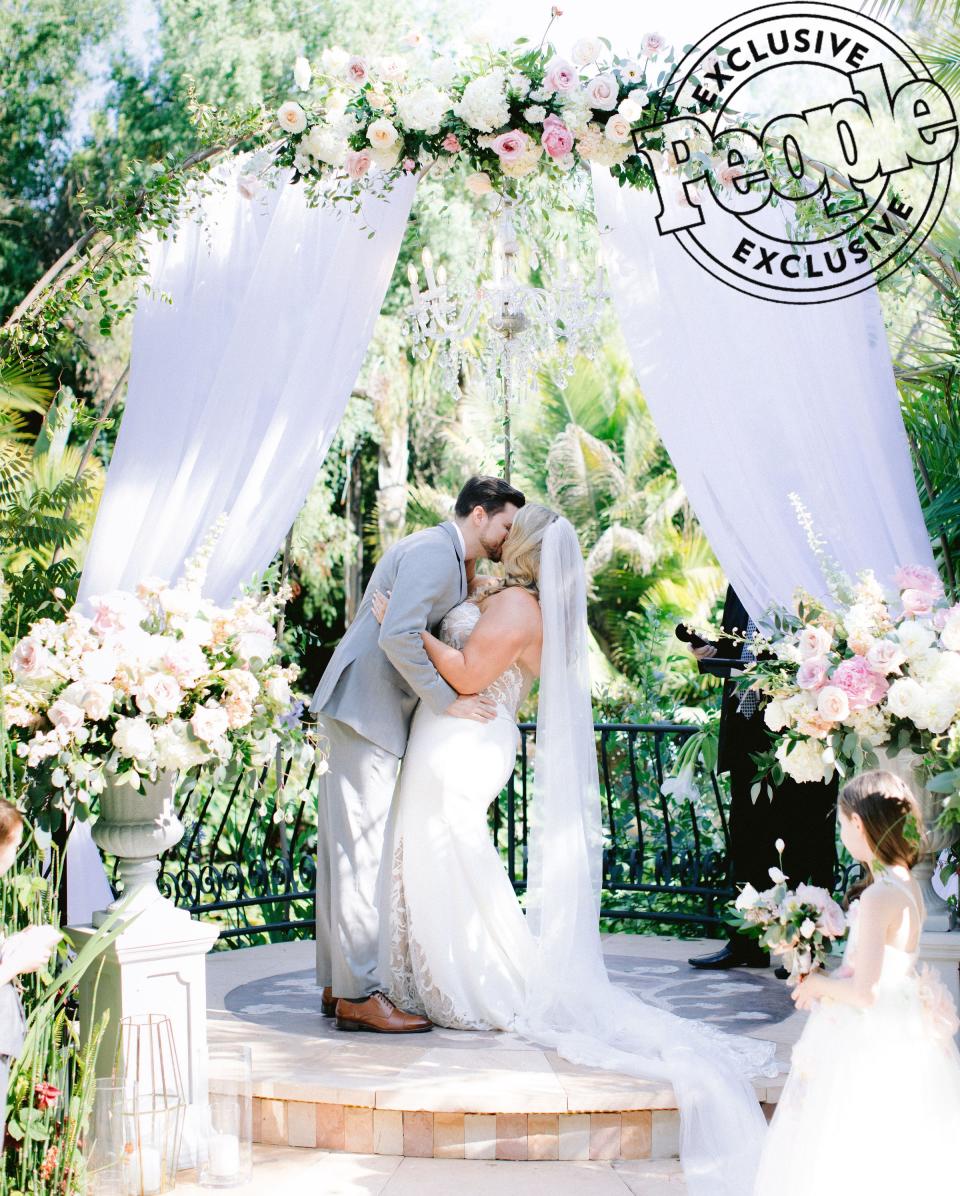 McGrady knew how she wanted her wedding to look since she was 14 — and she brought those dreams to life at <a href="https://edengardensweddings.com/" rel="nofollow noopener" target="_blank" data-ylk="slk:Eden Gardens;elm:context_link;itc:0;sec:content-canvas" class="link ">Eden Gardens</a> in Moorpark, California. “[My vision] is quite literally exactly how mine is planned,” she said. “The dress that I had chosen and I had loved is very similar to the one that was made for me. It came out exactly how I wanted it. It was a really surreal moment.” The model paired her dress with a veil by <a href="https://daphnenewmandesign.com/?gclid=EAIaIQobChMIhuW1oeO-4gIVl6_ICh0BPQhCEAAYASAAEgLbt_D_BwE" rel="nofollow noopener" target="_blank" data-ylk="slk:Daphne Newman;elm:context_link;itc:0;sec:content-canvas" class="link ">Daphne Newman</a> and earrings by <a href="https://www.heartsonfire.com/" rel="nofollow noopener" target="_blank" data-ylk="slk:Hearts on Fire;elm:context_link;itc:0;sec:content-canvas" class="link ">Hearts on Fire</a>.