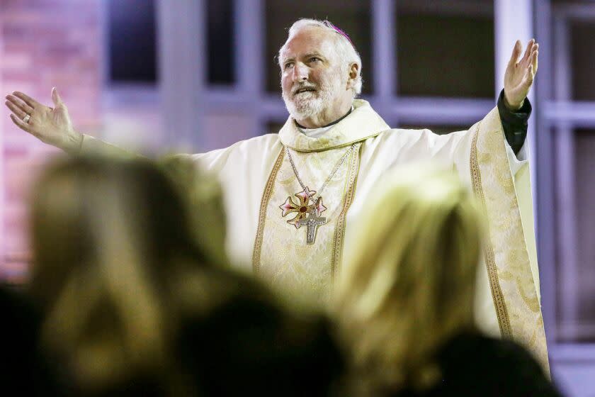 Long Beach, CA, Saturday, November 14, 2020 - Bishop David O'Connell of St. Cornelius Catholic Church, hosts a community memorial service as way in "this unusual year where Covid-19 has changed how we live and how we grieve" for people to gather together and celebrate those who have died. (Robert Gauthier/ Los Angeles Times)