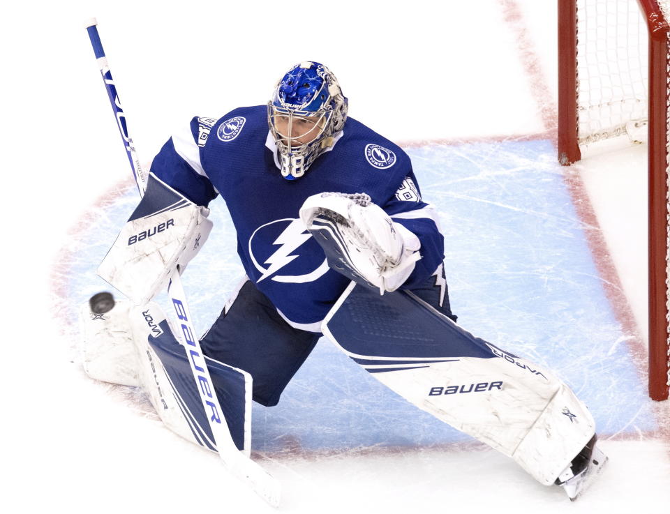 Tampa Bay Lightning goaltender Andrei Vasilevskiy (88) makes a save on the Columbus Blue Jackets during the third period in Game 1 of an NHL hockey Stanley Cup first-round playoff series, Tuesday, Aug. 11, 2020, in Toronto. (Frank Gunn/The Canadian Press via AP)