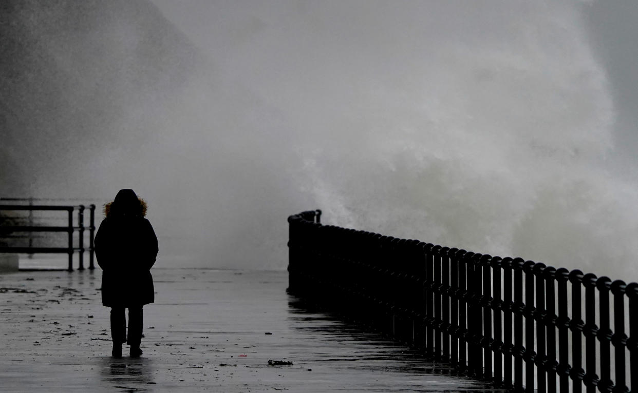 Waves crash over the promenade during rain and strong winds in Folkestone, Kent. The Met Office has issued warnings for heavy rains and floods, falling heaviest in western areas but causing wet and windy conditions all over the country. Picture date: Tuesday January 10, 2023. (Photo by Gareth Fuller/PA Images via Getty Images)