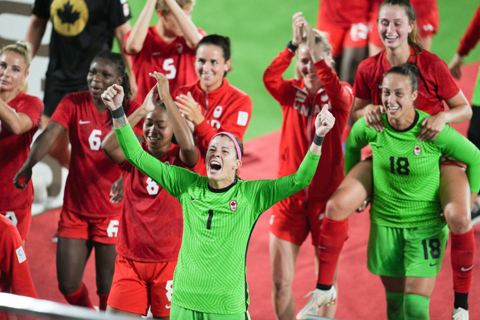 YOKOHAMA, JAPAN - AUGUST 6: Canada players including Stephanie Labbe #1 celebrate winning in the gold medal match during a game between Canada and Sweden at International Stadium Yokohama on August 6, 2021 in Yokohama, Japan. (Photo by Brad Smith/ISI Photos/Getty Images)