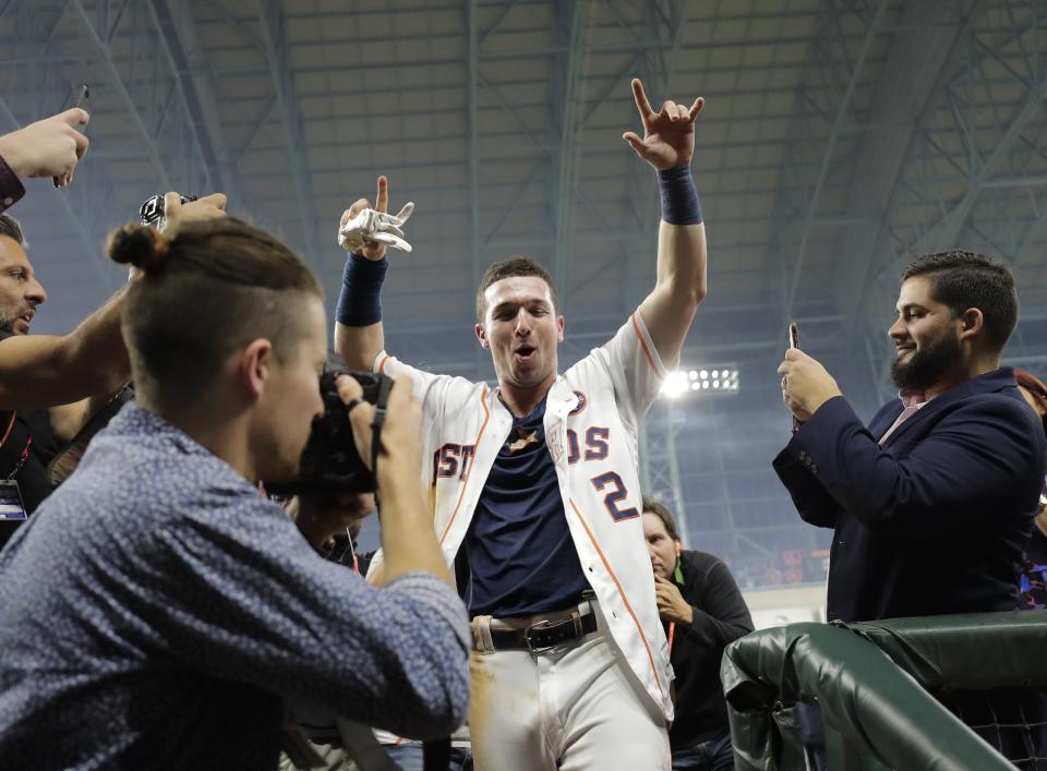 Alex Bregman celebrates after driving in the game-winning run during the 10th inning of Game 5. (AP)