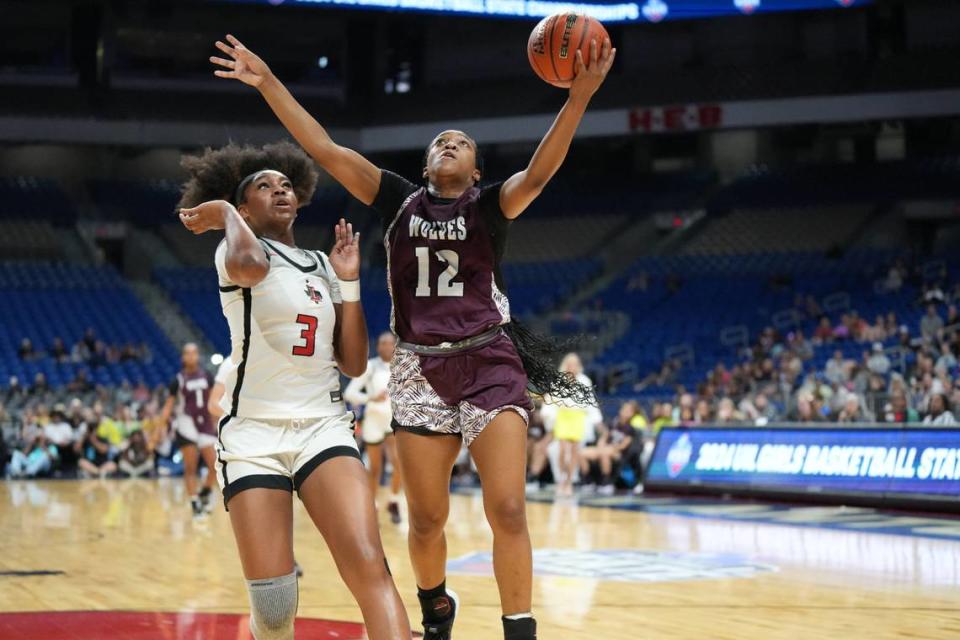 Mansfield Timberview’s Chrishawn Coleman goes up for two over Jacy Abii of Frisco Liberty in the Class 5A state championship game on Saturday, March 2, 2024 at the Alamodome in San Antonio, Texas. Liberty rallied to defeat Timberview 60-51.