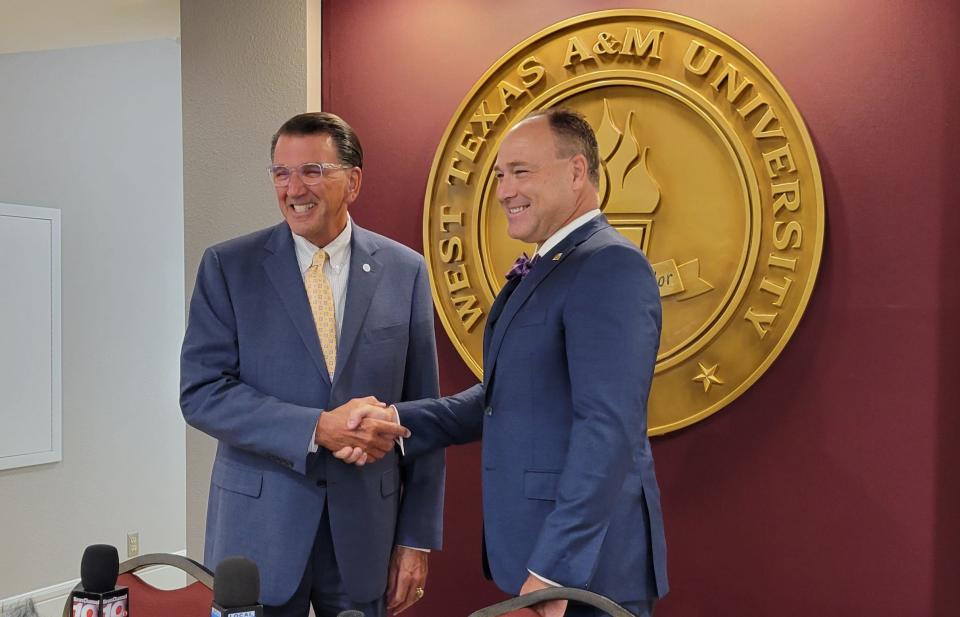 West Texas A&M President Walter Wendler and Weatherford College President Tod Farmer shake hands after signing a memorandum of understanding, granting Weatherford undergraduates easier access to WT's graduate program, Wednesday afternoon in the WT President's Office Suite.