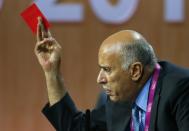 Jibril Al Rajoub, President of Palestinian Football Association, gestures with a red card as he addresses the 65th FIFA Congress in Zurich, Switzerland, May 29, 2015. REUTERS/Ruben Sprich TPX IMAGES OF THE DAY