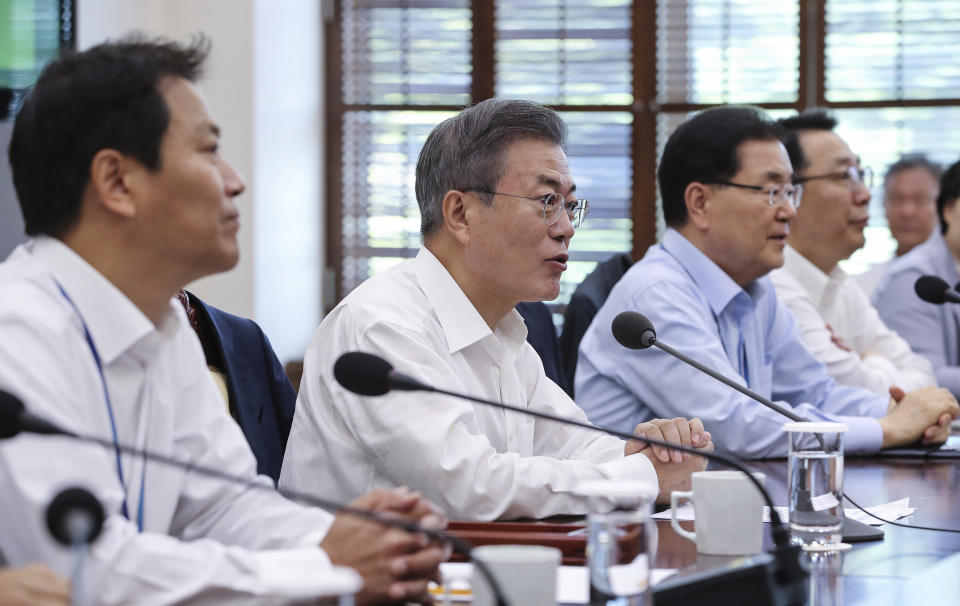 South Korean President Moon Jae-in, second from left, speaks during a cabinet meeting at the presidential Blue House in Seoul, South Korea, Monday, Sept. 17, 2018. A senior South Korean official on Monday played down the chance that this week's inter-Korean summit will result in major progress in efforts to rid North Korea of its nuclear program. (Hwang Gwang-mo/Yonhap via AP)