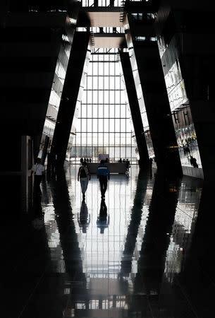 Visitors walk in the main entrance hall of new NATO headquarters during the move to the new building, in Brussels, Belgium April 19, 2018. REUTERS/Yves Herman