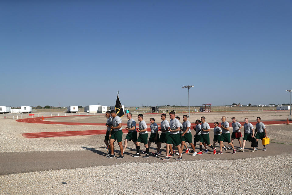 <p>U.S. Border Patrol trainees walk in formation after a physical training class at the U.S. Border Patrol Academy on August 3, 2017 in Artesia, N.M. (Photo: John Moore/Getty Images) </p>