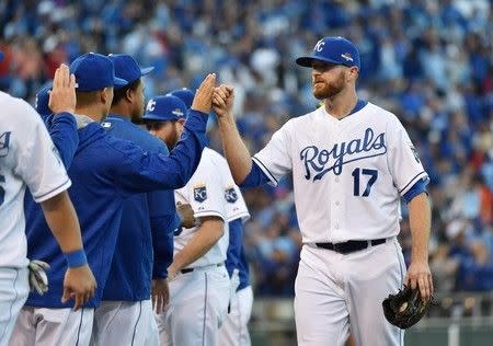 Oct 9, 2015; Kansas City, MO, USA; Kansas City Royals relief pitcher Wade Davis (17) celebrates with teammates after defeating the Houston Astros in game two of the ALDS at Kauffman Stadium. Mandatory Credit: Peter G. Aiken-USA TODAY Sports