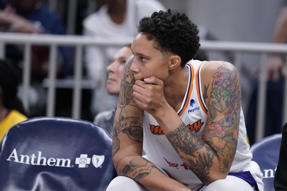 Phoenix Mercury's Brittney Griner watches from the bench during the first half of a WNBA basketball game against the Indiana Fever, Sunday, June 11, 2023, in Indianapolis. (AP Photo/Darron Cummings)