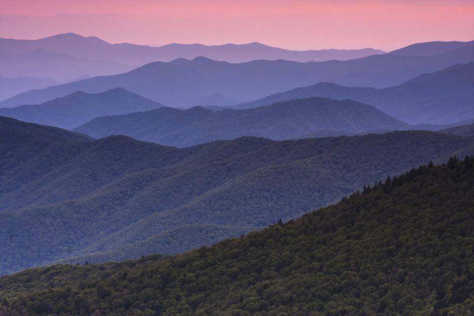 <p><a href="https://www.nps.gov/grsm/index.htm" rel="nofollow noopener" target="_blank" data-ylk="slk:Great Smoky Mountains National Park;elm:context_link;itc:0;sec:content-canvas" class="link "><strong>Great Smoky Mountains National Park </strong></a></p><p>This mountain range spans the borders of Tennessee and North Carolina, and is the most popular national park — meaning you can expect crowds. But you can also expect stunning views and these smoky sunsets! </p>