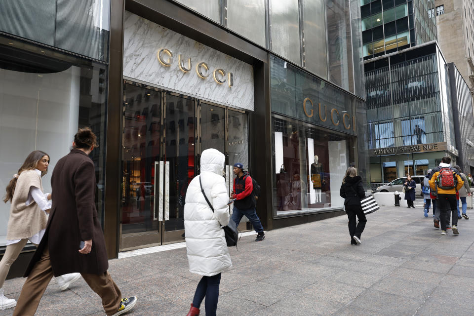 NEW YORK, NEW YORK - MARCH 20: People walk past the Gucci store on Fifth Avenue on March 20, 2024 in New York City. French luxury group Kering, owner of Gucci, had its shares drop 14% after the announced that Gucci sales are set to fall 20% year-on-year in Q1, amid declining Asia transactions. (Photo by Michael M. Santiago/Getty Images)