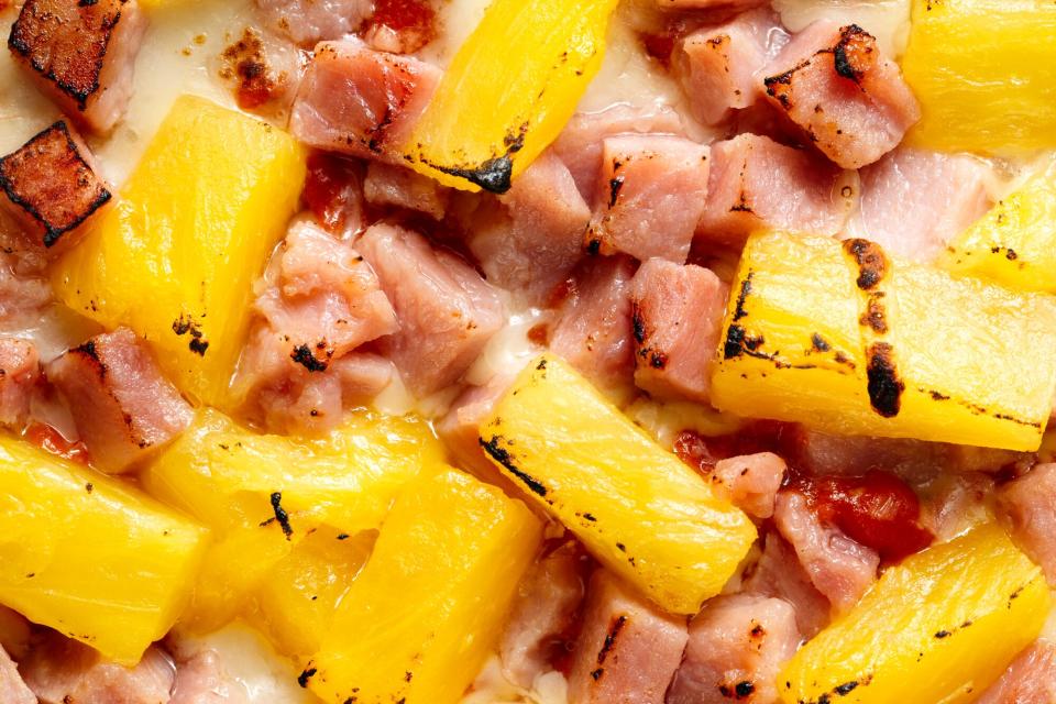 Close-up of a ham and pineapple pizza