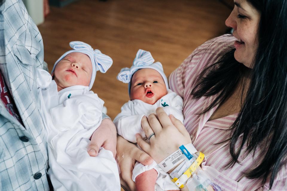 Kelsey Hatcher and her husband, Caleb hold their twin daughters Roxi Layla and Rebel Laken on Thursday. Hatcher, 32, from Alabama who was born with two uteruses and became pregnant in both, gave birth to twin girls on different days, she announced on Friday.