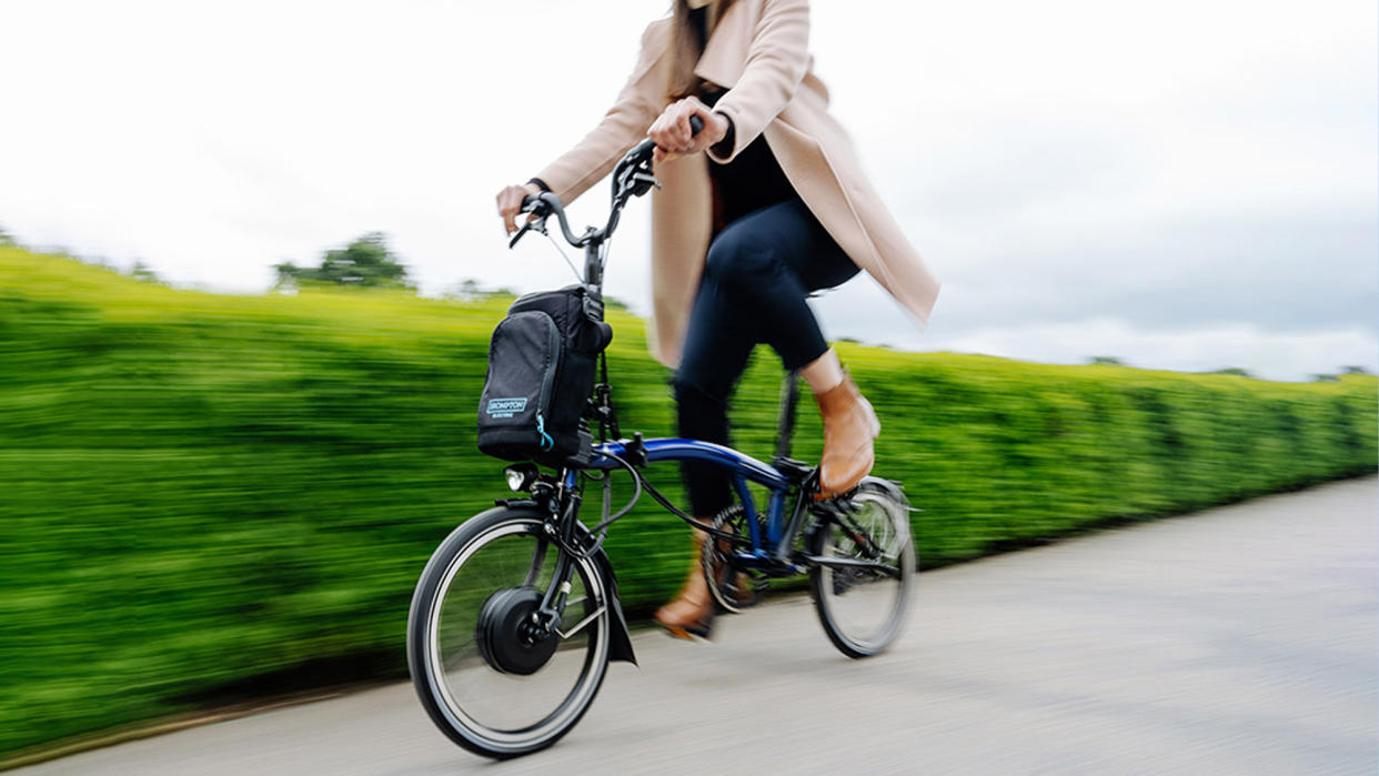  Woman riding Brompton Electric C Line Explore 