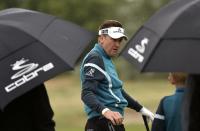 Ian Poulter of England practices on the driving range ahead of the British Open Championship at the Royal Liverpool Golf Club in Hoylake, northern England July 16, 2014. REUTERS/Toby Melville (BRITAIN - Tags: SPORT GOLF)