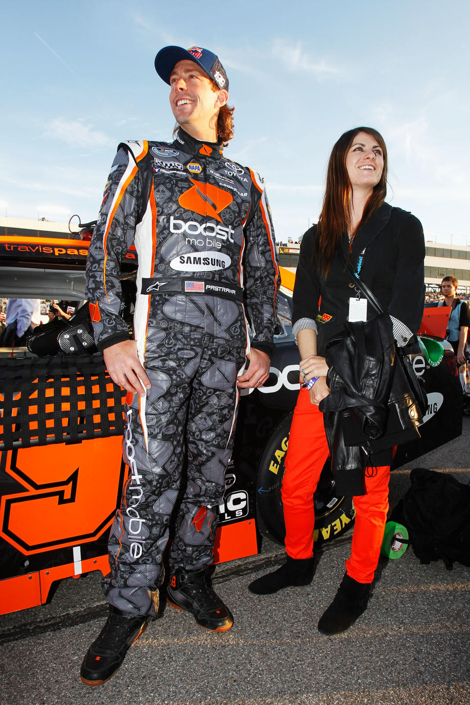 RICHMOND, VA - APRIL 27: Travis Pastrana (L), driver of the #99 Boost Mobile Toyota, and his wife Lyn-Z stand on the grid before the NASCAR Nationwide Series Virginia 529 College Savings 250 at Richmond International Raceway on April 27, 2012 in Richmond, Virginia. (Photo by Todd Warshaw/Getty Images for NASCAR)