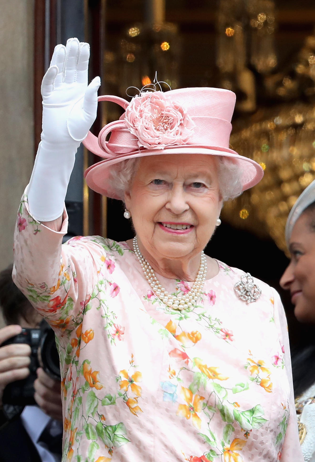 The Queen has a fake hand for waving to her fans