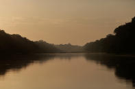 <p>The sun sets at the Mamiraua Sustainable Development Reserve in Uarini, Amazonas state, Brazil, Feb. 9, 2018. (Photo: Bruno Kelly/Reuters) </p>