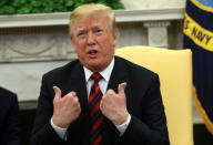 U.S. President Donald Trump gestures as he welcomes South Korea's President Moon Jae-In in the Oval Office of the White House in Washington, U.S., May 22, 2018. REUTERS/Kevin Lamarque