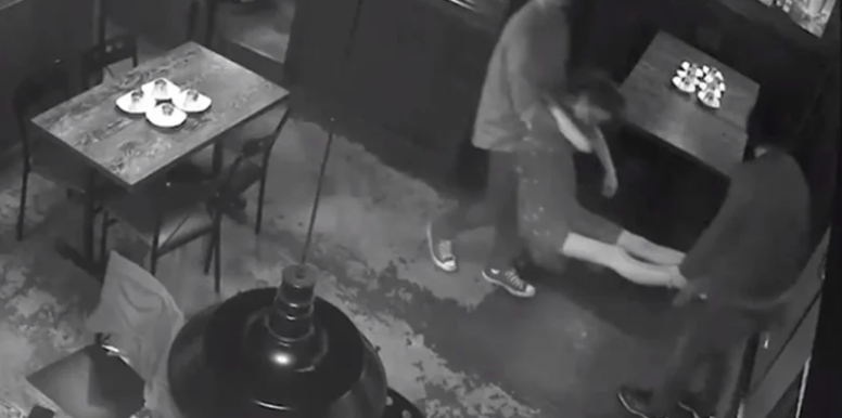"Potentially life-threatening": A woman can be seen being carried from the restaurant on the CCTV (NSW Liquor & Gaming Authority)