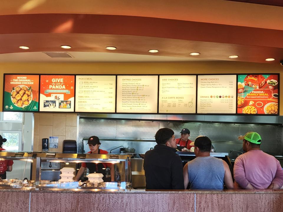 Lit up menu above counter at Panda Express