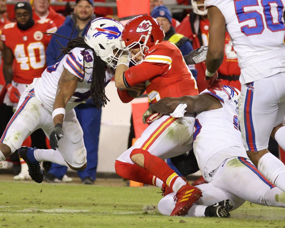 Chiefs quarterback Patrick Mahomes is tackled by Bills linebacker Tremaine Edmunds. 