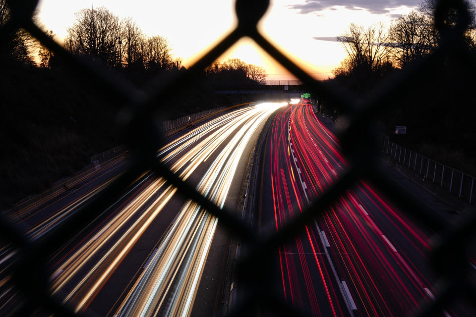 In this long exposure photo, motor vehicles move along Interstate 276 in Feasterville, Pa., Thursday, Dec. 21, 2023. (AP Photo/Matt Rourke)