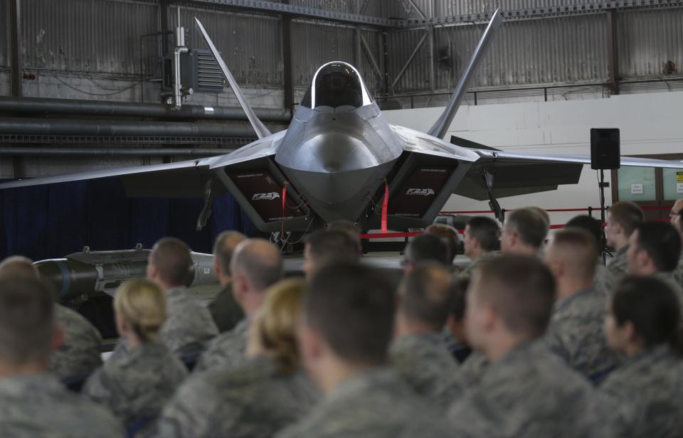 Soldiers listen in front of an U.S. Air Force F-22 Raptor fighter jet during a briefing in a hangar at the U.S. Spangdahlem Air base, Germany: REUTERS