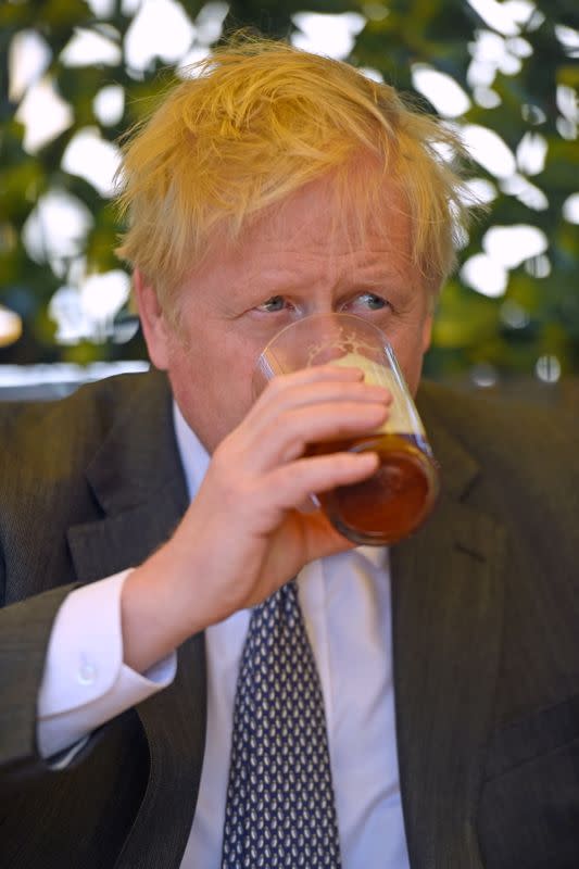 FILE PHOTO: British PM Johnson visits local elections campaign in Wolverhampton