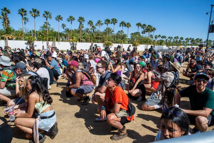 Fans of Beach Bunny follow a prompt to get low before jumping back up together during their performance on the Outdoor Stage during the Coachella Valley Music and Arts Festival in Indio, Calif., on Saturday, April 23, 2022.