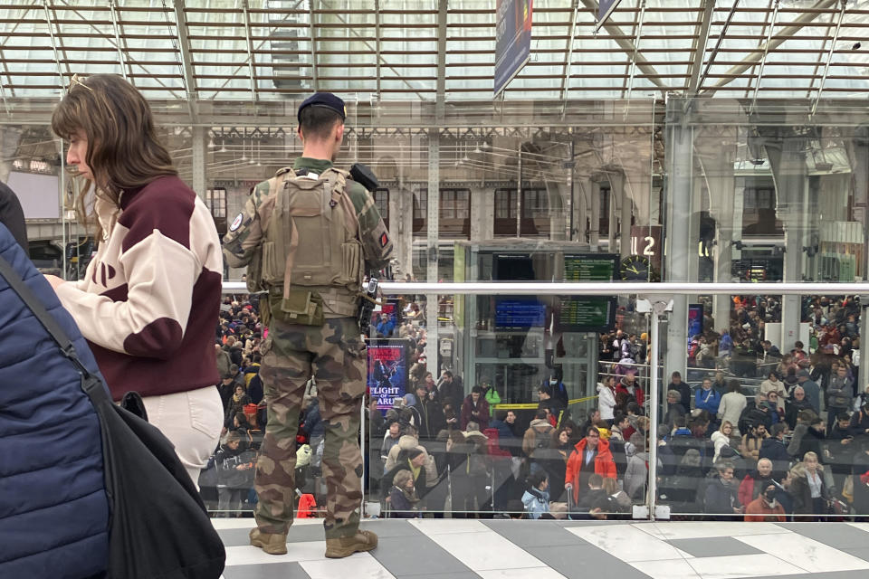 A soldier patrols inside the Gare de Lyon station after an attack, Saturday, Feb. 3, 2024 in Paris. A man injured three people Saturday in a stabbing attack at the major Gare de Lyon train station in Paris, another nerve-rattling security incident in the Olympic host city before the Summer Games open in six months. (AP Photo/Christophe Ena)