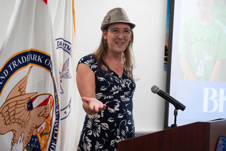 Autumn Mahoney, GEKOT FIRST LEGO League Robotics Team mentor, delivers a speech while being honored with student inventors from the Bloomfield Hills school district for a patent of their e-scooter safety device at River Place in Detroit on Tuesday, Aug. 9, 2023.