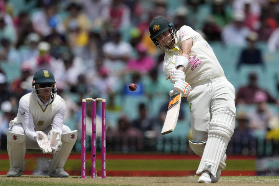 Australia's Steve Smith hits a six off South Africa's Simon Harmer during the second day of their cricket test match at the Sydney Cricket Ground in Sydney, Thursday, Jan. 5, 2023. (AP Photo/Rick Rycroft)