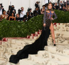 <p> This custom-made Balmain turned just about every head at the 2018 Met Gala (the theme won't surprise you: "Heavenly Bodies: Fashion and the Catholic Imagination." Yup! Nailed it!). Inspired by a 1988 <em>Vogue</em> cover, the dress took a month to make and was so intricate that there were jewels <em>on the dress' feathers</em>. When J. Lo decides she's going to go all out, complete with a long train, she does it in style. </p>