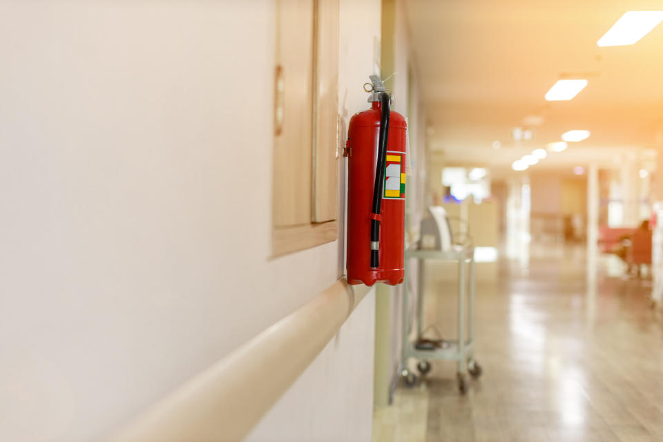 Fire extinguisher hanging on wall